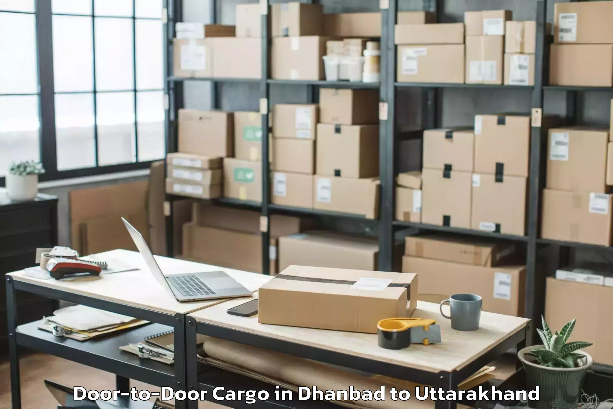 Easy Dhanbad to Banbasa Door To Door Cargo Booking